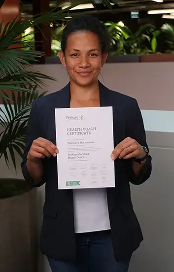 Telesia Fa. Macnamara, Hauora Whakaako Coach and PREKURE Health Coach, holding her Health Coach Certificate. Click to view full bio.